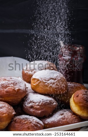 Falling powder sugar on donuts