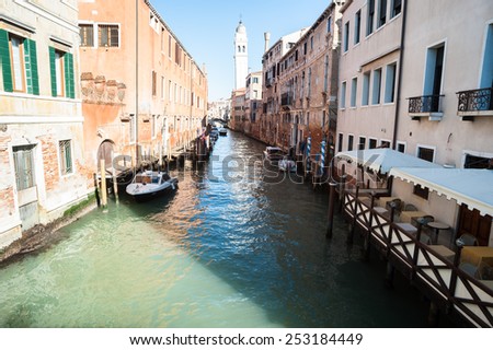 Classical picture of the venetian canals with gondola  