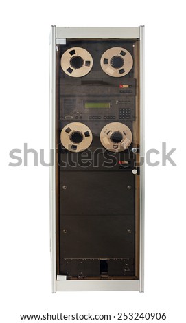 Old computer with tape memory Royalty-Free Stock Photo #253240906