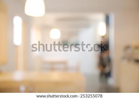 Abstract blurry bright restaurant interior with unrecognizable waitress
