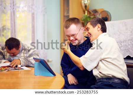 happy friends with disability socializing through internet Royalty-Free Stock Photo #253283755