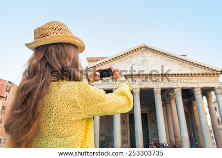 Young woman taking photo of pantheon in rome, italy