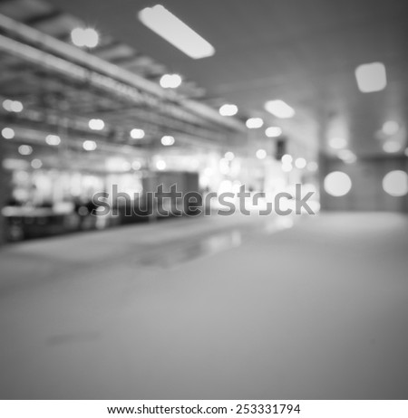 Trade show lights background. Intentionally blurred, editing post production. Black and white.