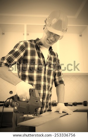 worker with jigsaw shortens floorboard, instagram image style