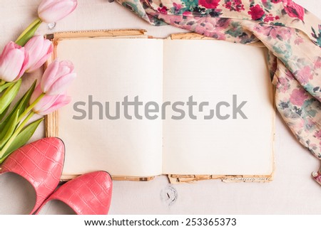 Pink tulips with ballerinas shoes over white wooden table background Royalty-Free Stock Photo #253365373