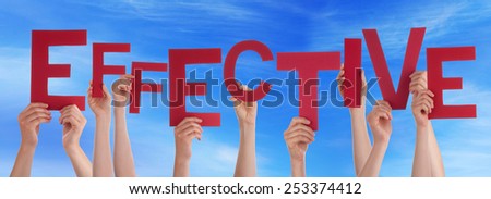 Many Caucasian People And Hands Holding Red Letters Or Characters Building The English Word Effective On Blue Sky