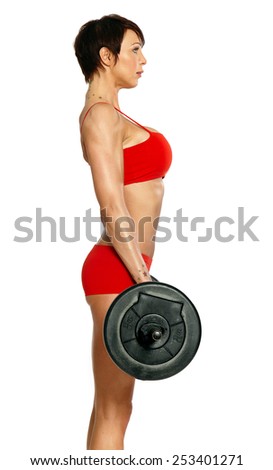 Caucasian woman with barbell wearing red training bikini isolated on white.