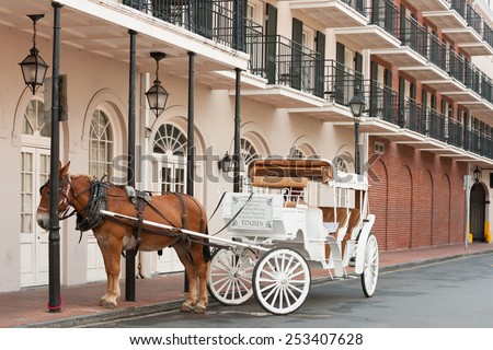Elegant horse-drawn carriage in French Quarter, New Orleans Royalty-Free Stock Photo #253407628