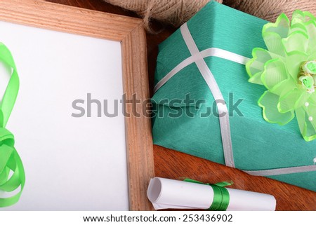green gift box with empty white paper