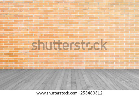 Orange-brown brick wall with wood floor in grey background of interior decoration