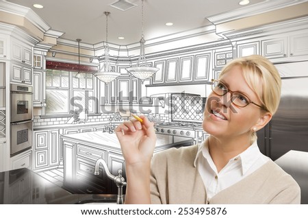 Creative Woman With Pencil Over Custom Kitchen Design Drawing and Photo Combination.