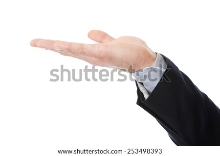 Businessman's hand holding copyspace on palm.