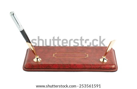 Red leather pen holder isolated over the white background