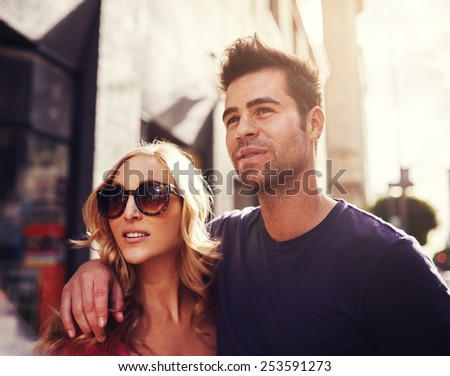 couple together in down town LA shot with lens flare and creative color filtering