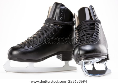 Pair of Black Professional Figure skates With Sharp Blades Over White Background. Horizontal Image Composition