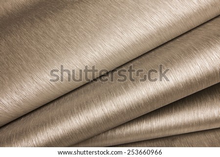 Abstract image of beige paper rolls