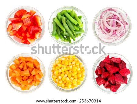 Assortment of cut vegetables in glass bowls isolated on white background. Top view. Royalty-Free Stock Photo #253670314