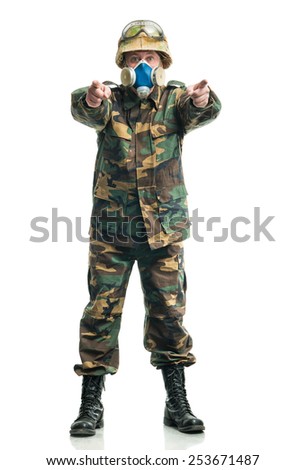 Soldier in camouflage and a respirator 