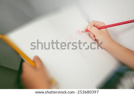 children's hands and crayons