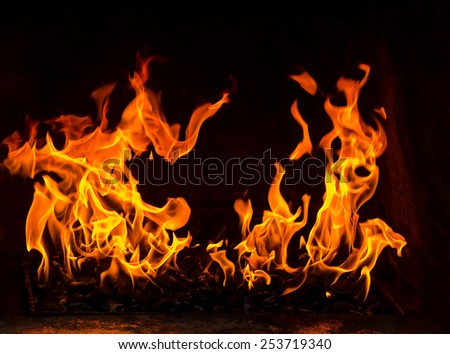 fire in the oven with coal on the black background