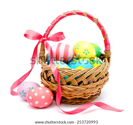 Colorful handmade easter eggs in the basket isolated on a white background