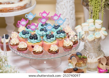 Cupcake,candy bar at a wedding in the style of Alice in Wonderland
