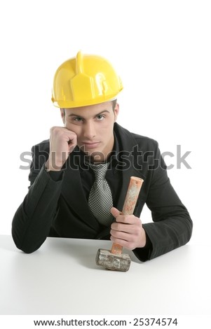 Architect with hammer and yellow helmet, sad mood isolated on white