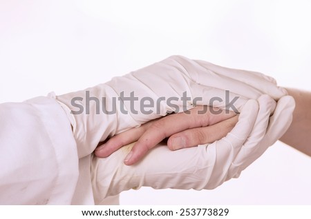 closeup of doctor's hands comforting patient isolated on white