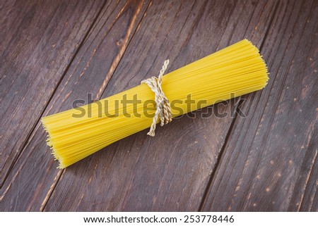 Pasta on wooden background - vintage effect style pictures