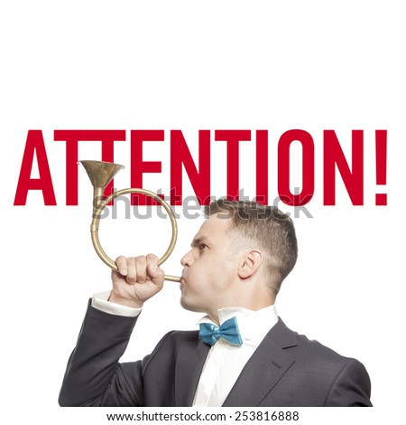 Funny man in blue bow tie blowing into the trumpet with title 'attention'  