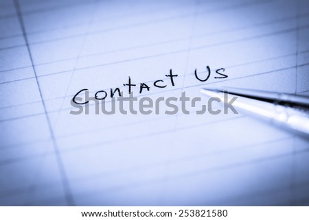 Contact us, sign in the notebook by pen. Image in cold toning