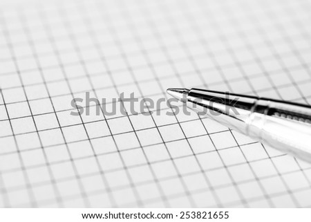 Pen on the paper closeup