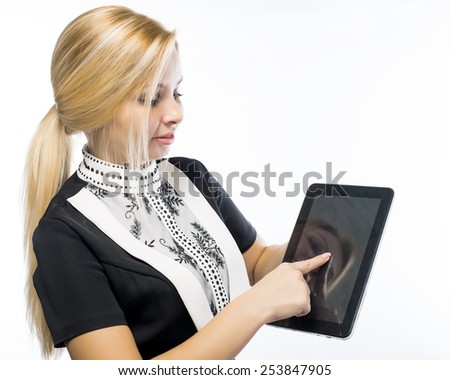 white tablet with a  blank screen in the hands on wooden table