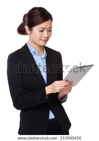 Businesswoman uses tablet