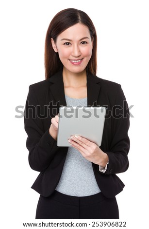 Businesswoman uses tablet