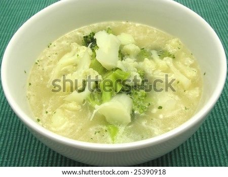 Soup with cauliflower and broccoli in a bowl of chinaware
