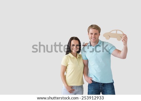 Young couple with a cardboard car