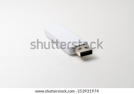 White USB pendrive. Shoot over white background. Focus on the closes distance. Shallow depth of field.