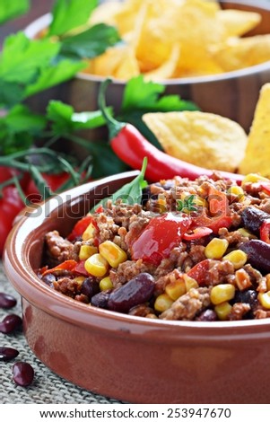 Chili con carne and fresh vegetables.Selective focus.