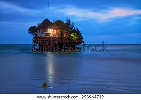 Rock romantic restaurant in Indian ocean near Zanzibar coastline