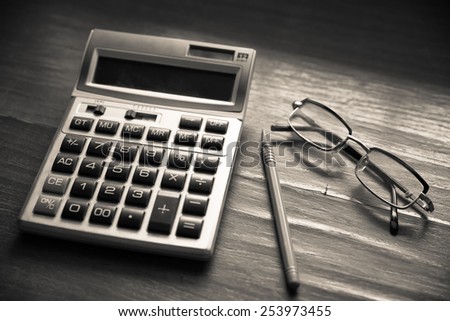 Glasses and the calculator on documents.