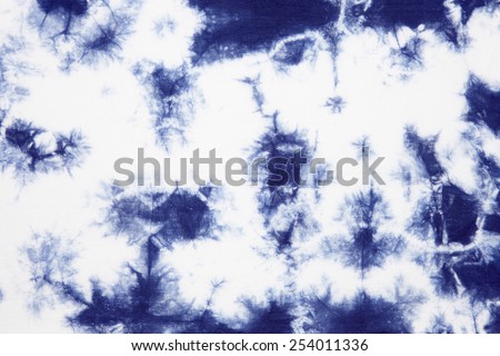 Abstract tie dyed fabric background  Royalty-Free Stock Photo #254011336