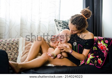 Mother and baby on the sofa