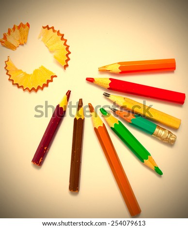 set of a old colored pencils with shavings on the white background. copy space