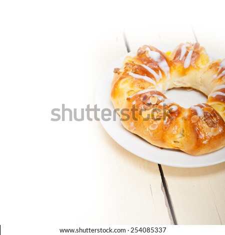 fresh home baked sweet bread donut cake with almonds and icing sugar on top
