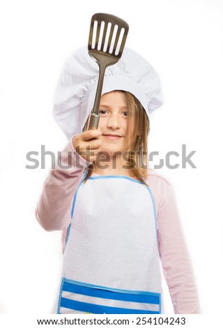 Happy little chef holding kitchen utensil