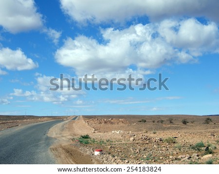 Highway road to the Sahara Desert, Morocco  Royalty-Free Stock Photo #254183824