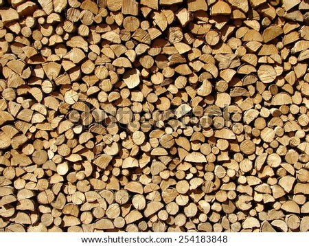 Background consisting of a multitude of logs and chopped  Royalty-Free Stock Photo #254183848