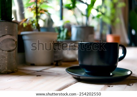 A coffee cup displayed in the window