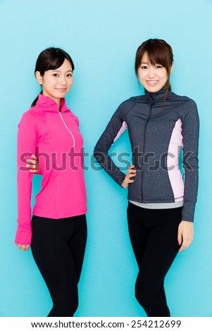 sporty attractive women on blue background